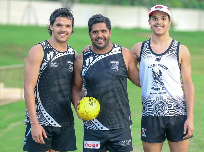 Alwyn Davey and his twin sons Alwyn Jr (R) and Jayden at Cazalys Oval ahead of the AFL national draft. Picture: Glenn Campbell