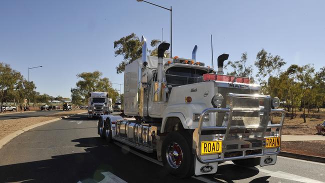 Truckies parade through town to the Road Transport Hall of Fame in Alice Springs.