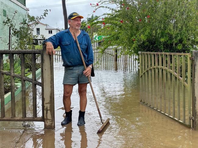 HOLD WEEKEND PAPERS - Guy with broom - Angelo Falconieri, 67, flooding at his home on Perkins St in Ingham - Photo Shayla Bulloch