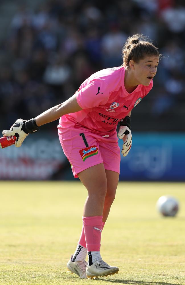 Teagan Micah picking up a can that was thrown on the pitch during her time playing for Melbourne City. Picture: Graham Denholm/Getty Images