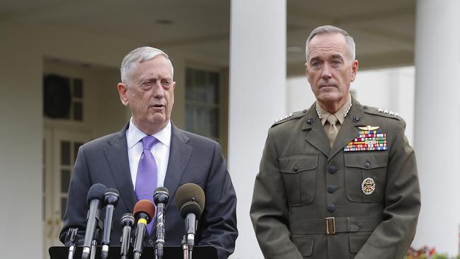 Defence Secretary Jim Mattis, left, accompanied by Joint Chiefs Chairman Gen. Joseph Dunford, right, speaks to members of the media outside the West Wing of the White House. Picture: AP