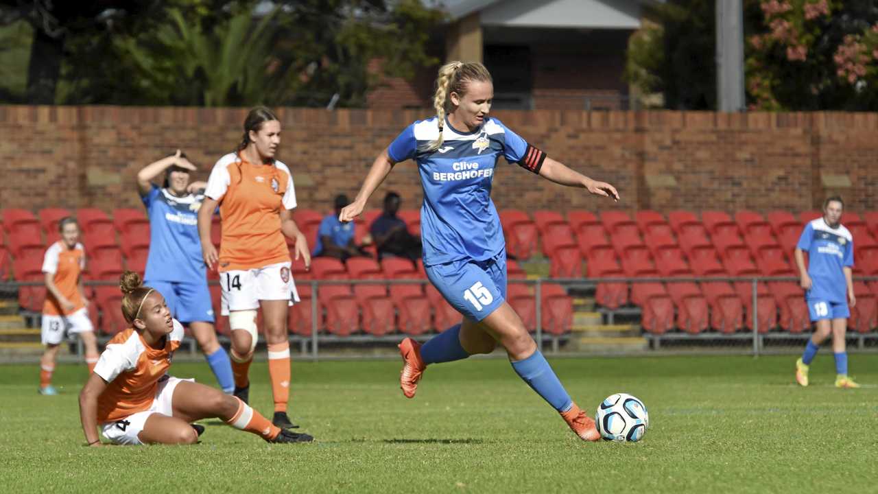 ON THE CHARGE: South West Queensland Thunder captain Melanie Lloyd takes on the Brisbane Roar defence earlier this season. The Thunder play Gold Coast tomorrow. Picture: Bev Lacey