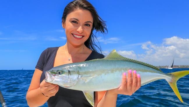 Bag and size limits are better than lockouts. Ann-Marie Gilchrist is all smiles with a Sydney kingfish she released. Picture: Al McGlashan