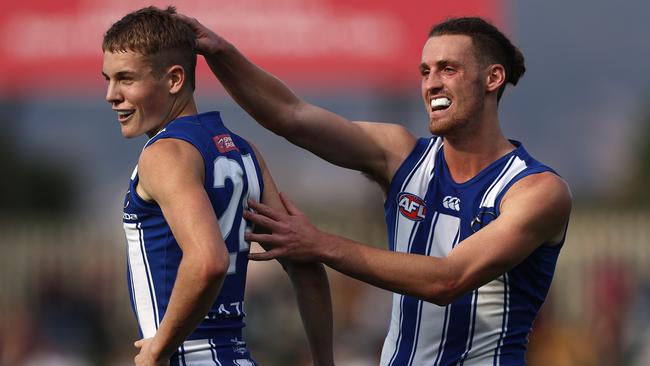 Tom Powell (left)— celebrates an early goal for the Kangaroos.