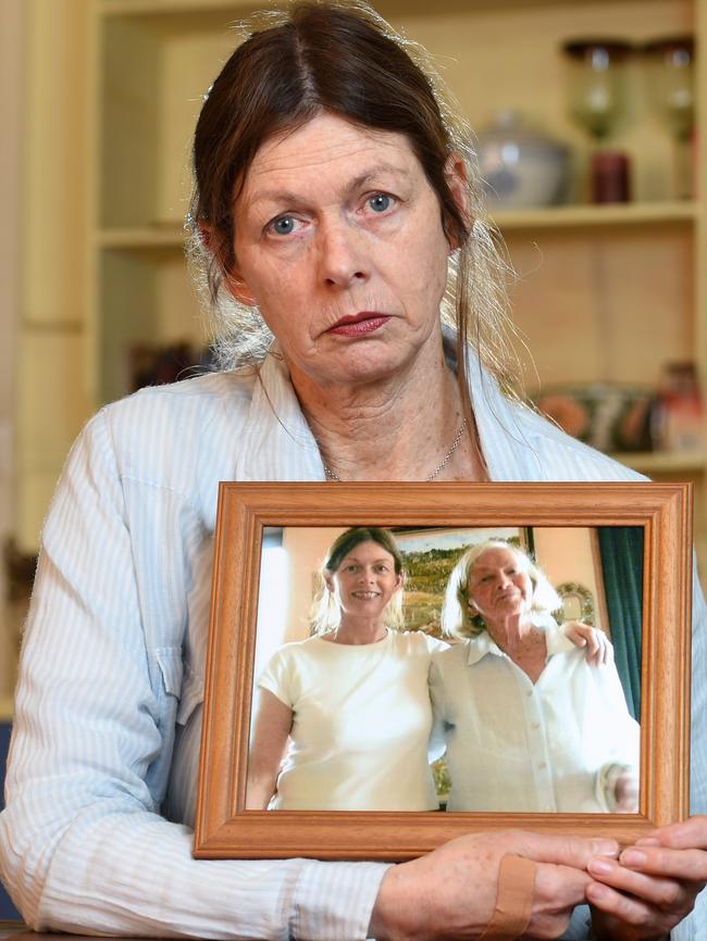Jane Sinclair holding a portrait of her and her mother Jean Sinclair who died at age 91. Picture: Kylie Else
