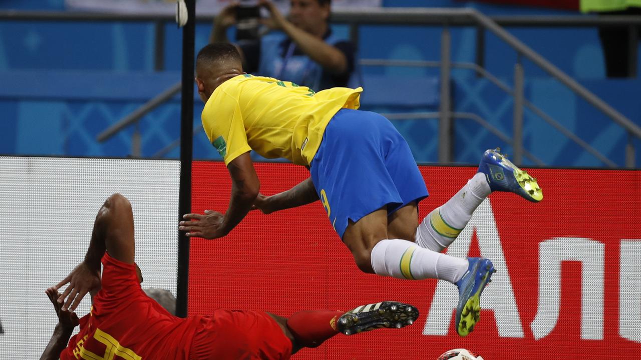 Belgium's Vincent Kompany, left, makes contact with Brazil's Gabriel Jesus