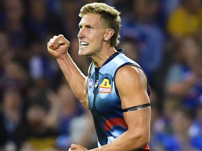 MELBOURNE, AUSTRALIA - MARCH 23: Aaron Naughton of the Bulldogs celebrates kicking a goal during the round one AFL match between the Western Bulldogs and the Sydney Swans at Marvel Stadium on March 23, 2019 in Melbourne, Australia. (Photo by Quinn Rooney/Getty Images)