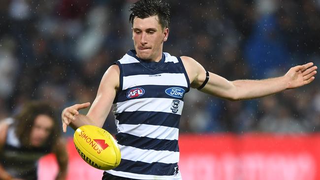 Geelong’s Charlie Constable gets a kick away during a 31-disposal Round 2 game against Melbourne. Picture: AAP Image/Julian Smith