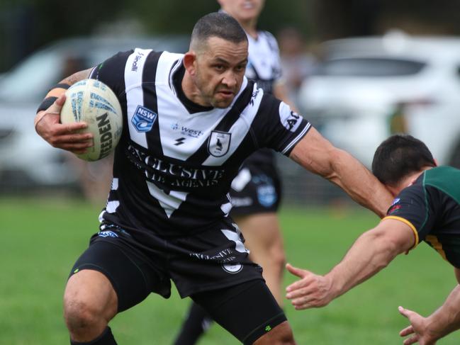 Picton’s Michael Lett takes on the defence. Picture: Warren Gannon Photography