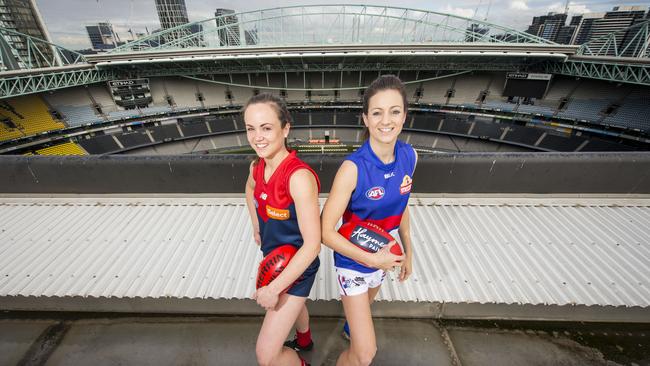 Melbourne captain Daisy Pearce and Bulldogs counterpart Steph Chiocci. Picture: Eugene Hyland