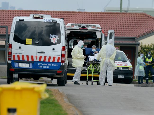 Medical staff remove patients from St Basil's Home for the Aged at Fawkner on July 27, 2020, days after the replacement workforce was in place. Picture: NCA NewsWire / Andrew Henshaw
