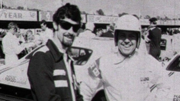 A young Peter Brock with co-driver Des West prepares to board his 1969 Monaro at Bathurst.