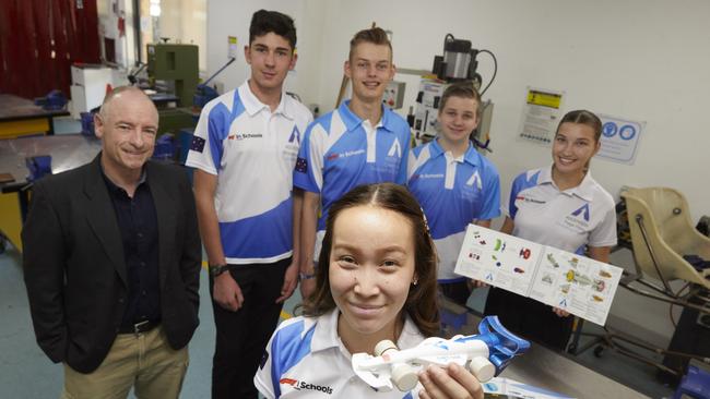 Penrith Christian School Head of Innovation and Technology, Martin Bishop, Brock Stinson, Caleb Kraus, Alexander Weeks, Paige Foley and Imogen Rogers (front) with the Ascensions F1 Race car model. Picture: AAP Image/Angelo Velardo.