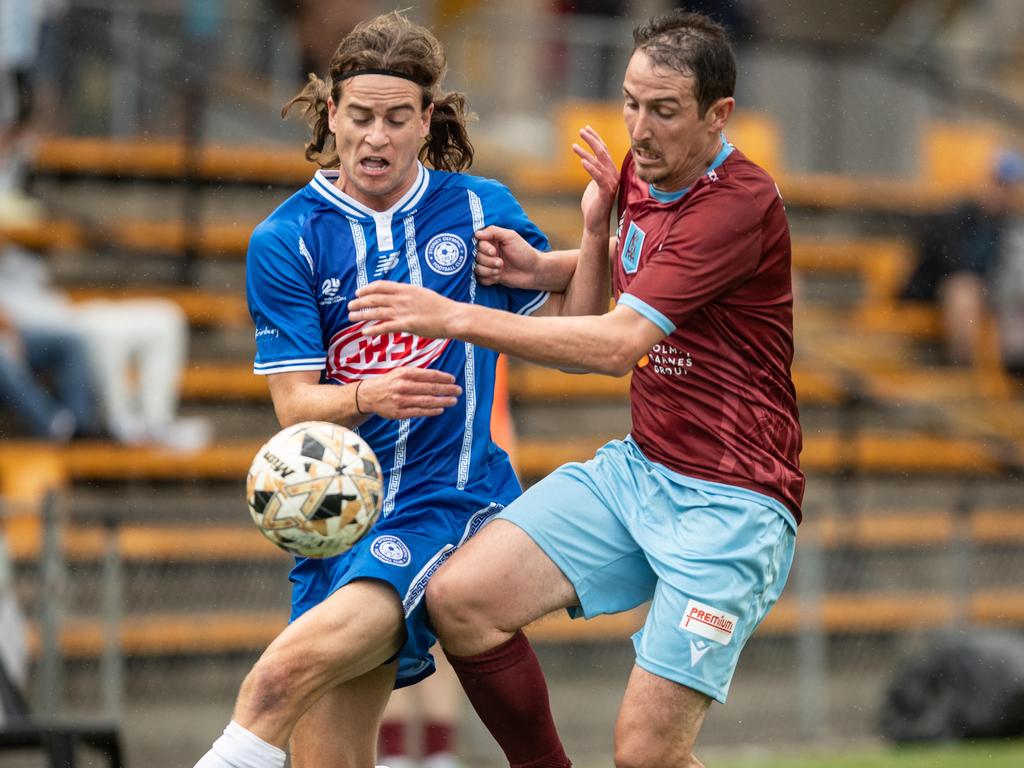 Josh Symons of APIA defending against Darcy Burgess. Picture: Julian Andrews