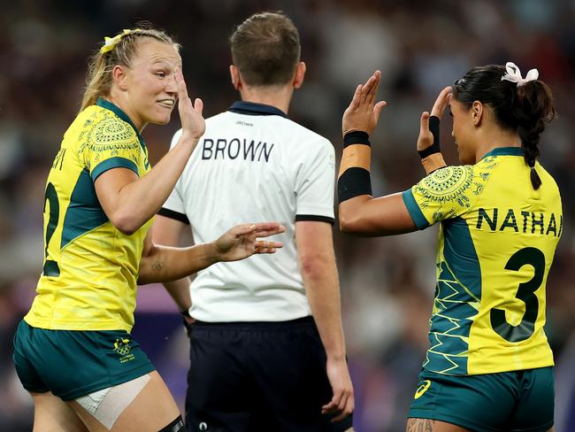 Maddison celebrates a try with teammate Faith Nathan. Picture: Getty Images