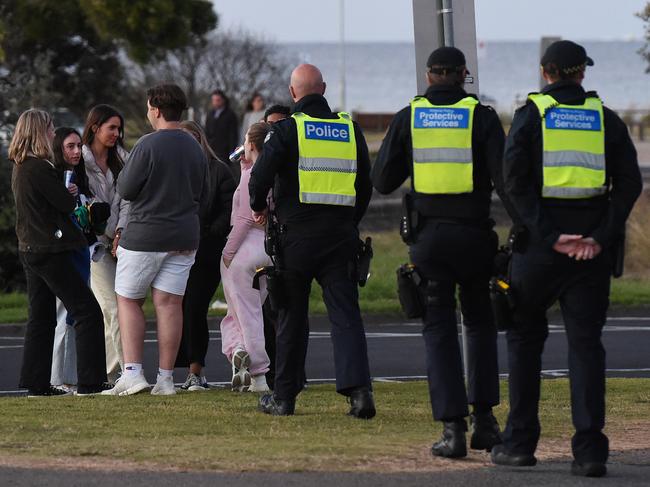 Police and PSOs patrol Rye Beach during schoolies in 2021. Picture: Josie Hayden