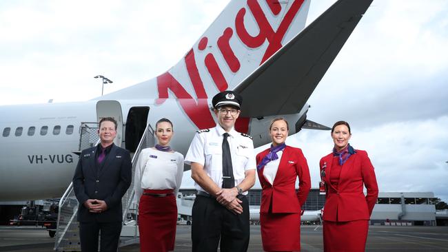 Virgin Australia is hopeful the industry support package will get more employees back to work. From L to R. Nico Porter (CS), Bianca Yates, Captain Paul Anderson, Delia Taylor and Cindy Donaghy from guest services. Picture: John Feder