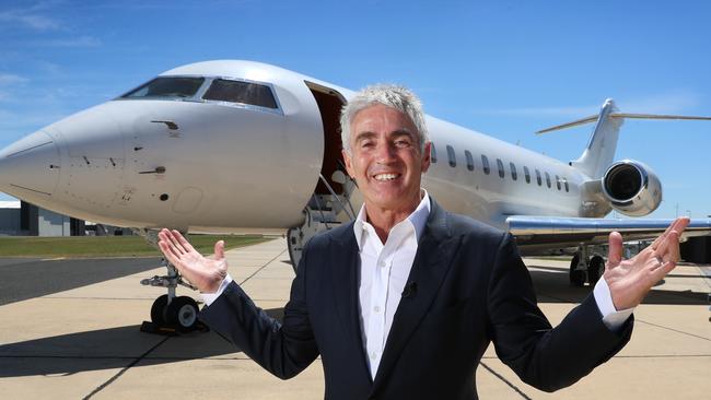Racing legend Mick Doohan with his private jet business, at Essendon Fields, in 2018. Picture: Alex Coppel