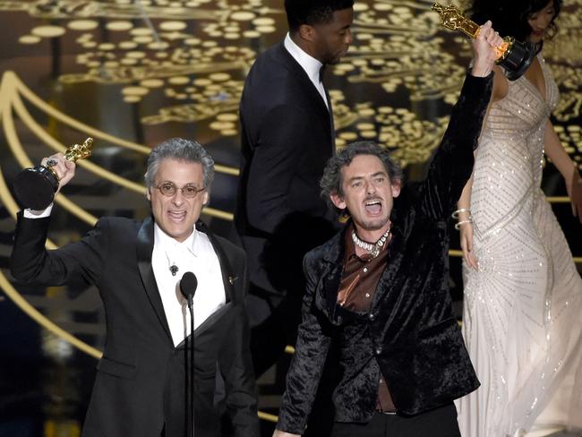 Mark Mangini, left, and David White accept the award for best sound editing for “Mad Max: Fury Road”.