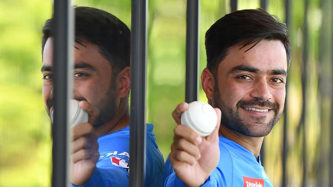 Superstar leg-spinner Rashid Khan who arrived Saturday night poses at the Karen Rolton Oval Pavilion during a practise match between Adelaide Strikers and the Perth Scorchers. Picture: Image AAP/Mark Brake.