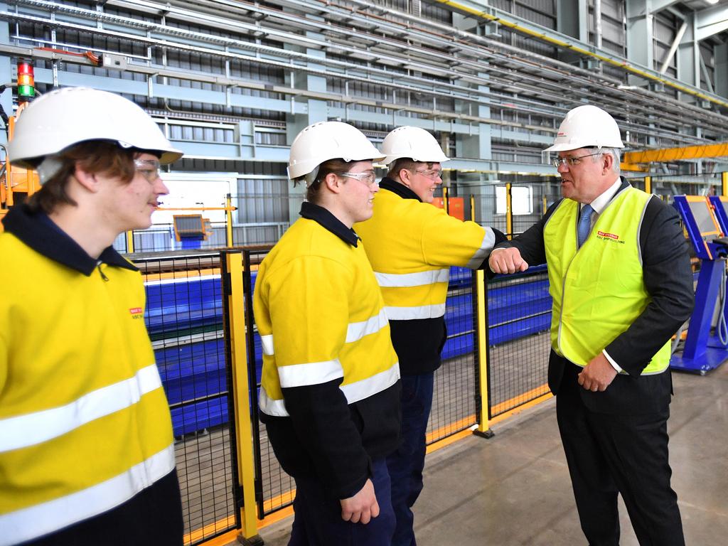 Prime Minister Scott Morrison greets workers during a tour of the Osborne Naval Shipyards in Adelaide. Picture: NCA NewsWire / David Mariuz.