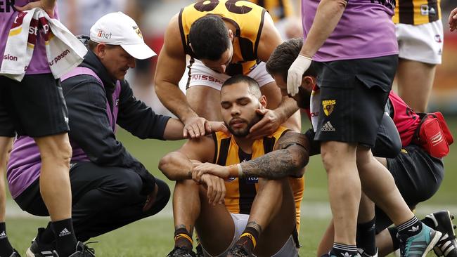 Jarman Impey receives attention after injuring his knee. Picture: Getty Images