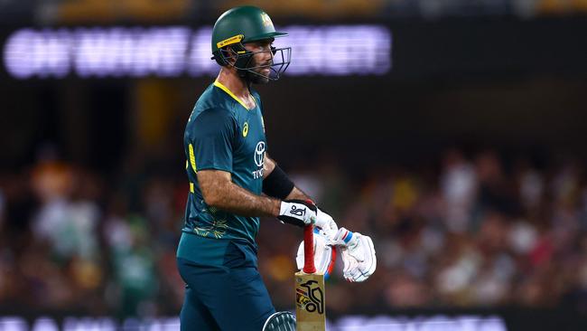 Australia's Glenn Maxwell walks back after his dismissal during the first Twenty20 international cricket match between Australia and Pakistan at The Gabba in Brisbane on November 14, 2024. (Photo by Pat HOELSCHER / AFP) / -- IMAGE RESTRICTED TO EDITORIAL USE - STRICTLY NO COMMERCIAL USE --