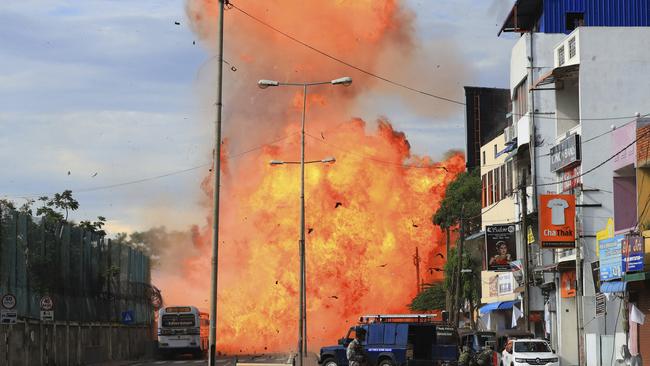 A bomb went off without warning as police inspected a van in Colombo, Sri Lanka one day after the Easter Sunday attacks. Picture: AP 