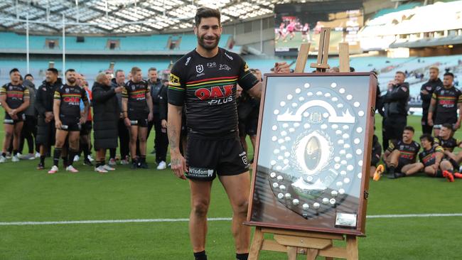 James Tamou of the Panthers is presented with the JJ Giltinan Shield.