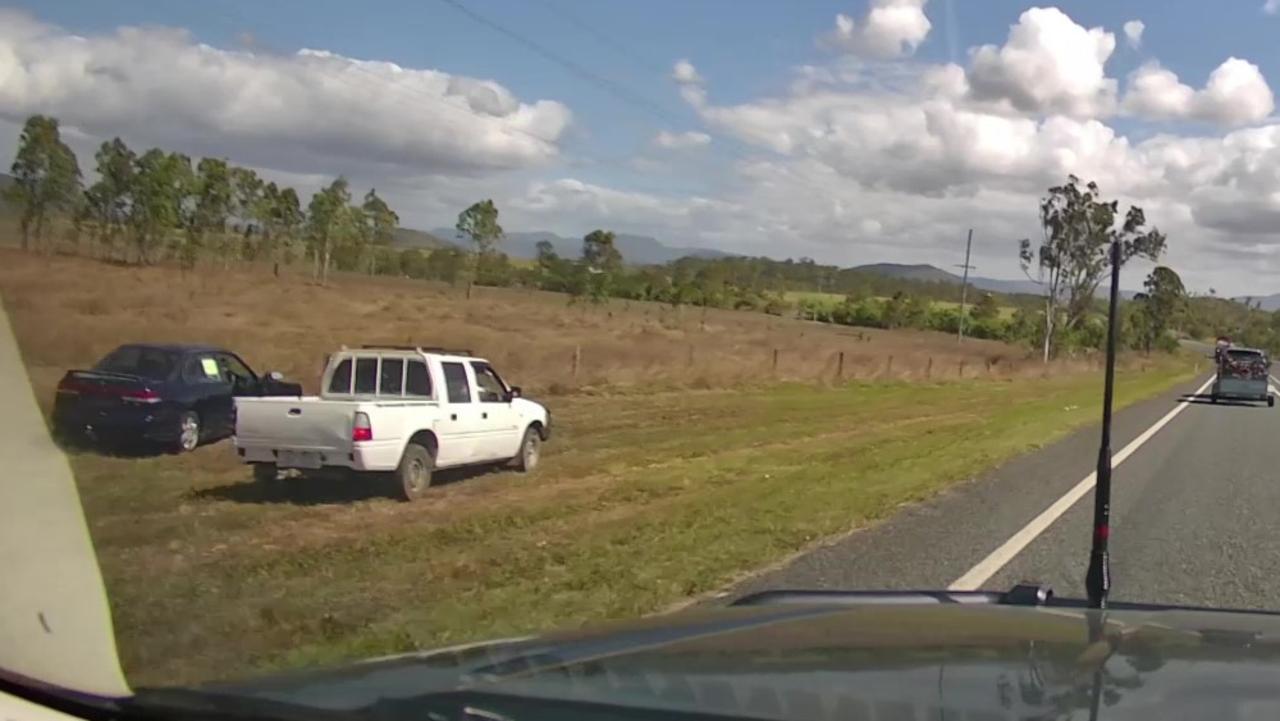 Dashcam footage has shown two men near a stolen Subaru Liberty moments before it went up in flames on the Bruce Highway near in Bloomsbury. Picture: Queensland Police Media