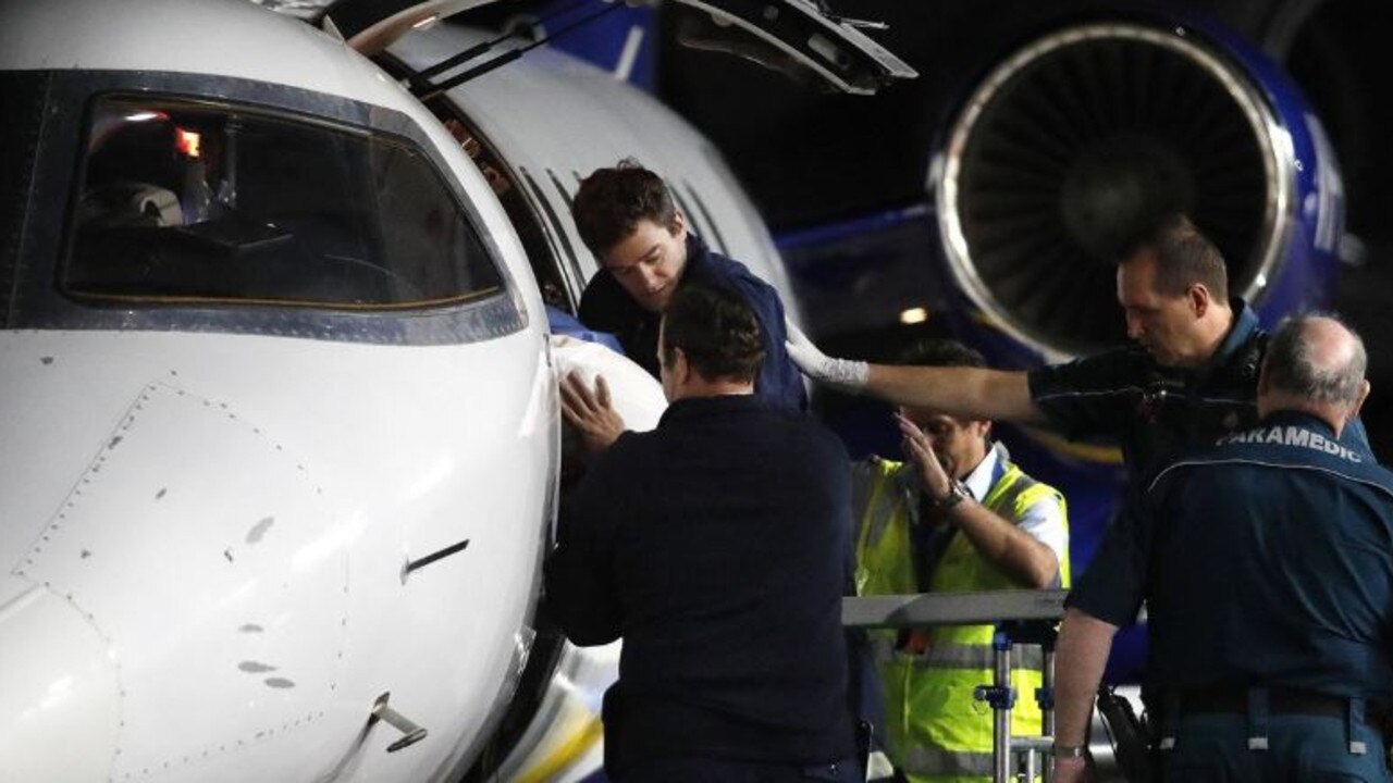 Injured workers from an explosion at Grosvenor coal mine at Moranbah arriving in Brisbane. Picture: Josh Woning/AAP