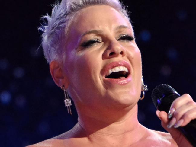 TOPSHOT - US singer-songwriter Pink (R) and her daughter Willow (L) perform on the fourth and last day of the Democratic National Convention (DNC) at the United Center in Chicago, Illinois, on August 22, 2024. Vice President Kamala Harris will formally accept the partyâs nomination for president today at the DNC which ran from August 19-22 in Chicago. (Photo by ANDREW CABALLERO-REYNOLDS / AFP)