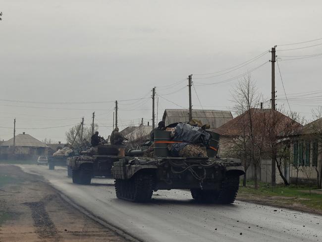 Tanks of Ukrainian Armed Forces ride along a street in a village, as Russia's attack on Ukraine continues, in Donetsk Region, Ukraine April 18, 2022.  REUTERS/Serhii Nuzhnenko