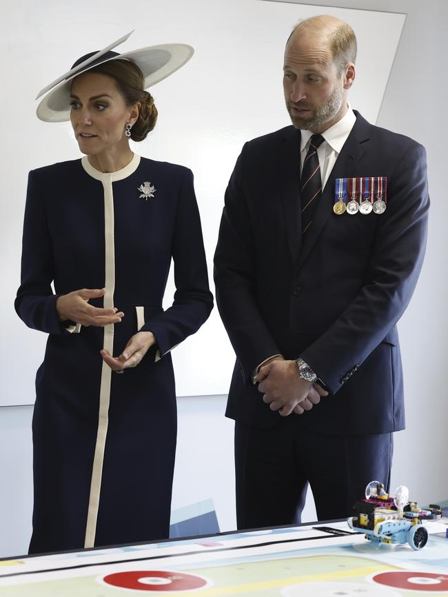The couple talk to staff at the Shipbuilding Academy. Picture: Andy Barr / The Scottish Sun / AP