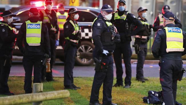 A large police presence can be seen at the base of the towers.. Picture: David Crosling