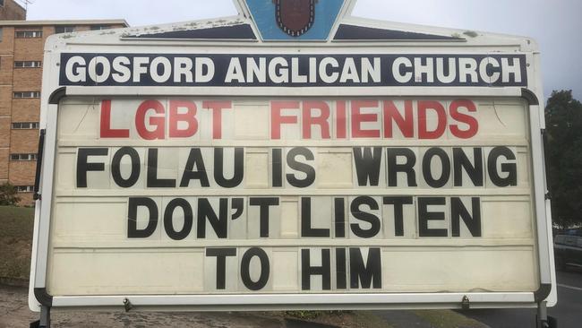 Father Rod Bower posted this sign on Monday to stand by the LGBT community in the face of negative comments from sacked rugby star Israel Folau.