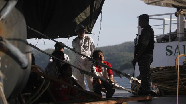 Crew of a Thai-owned cargo ship seized by the Indonesian Navy for alleged slave labour.