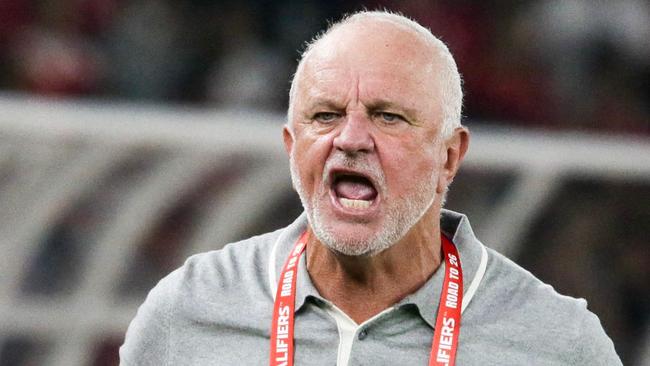 Australia's coach Graham Arnold (C) reacts to the referee as Australia's Awer Mabil (L) and Indonesia's Calvin Verdonk (R) wait during the 2026 FIFA World Cup Asian qualification football match between Indonesia and Australia at Gelora Bung Karno Stadium in Jakarta on September 10, 2024. (Photo by ADITYA AJI / AFP)