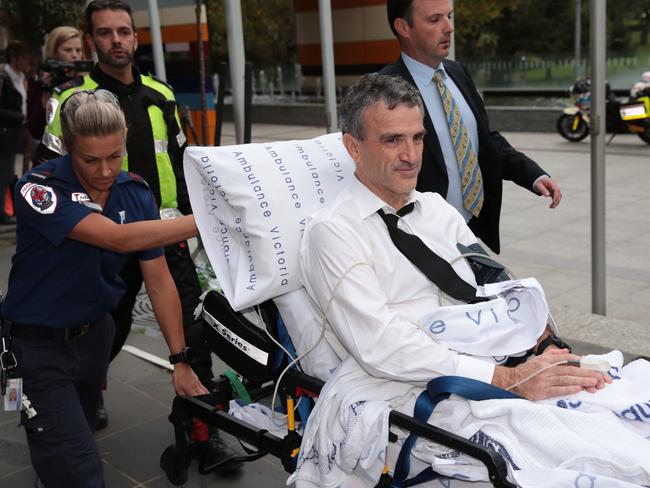 Dover owner Terry McMaster leaves the Federal Court on a stretcher. Picture: Stefan Postles