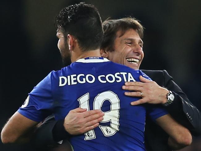 LONDON, ENGLAND - DECEMBER 31: Antonio Conte, Manager of Chelsea congratulates Diego Costa after the Premier League match between Chelsea and Stoke City at Stamford Bridge on December 31, 2016 in London, England. (Photo by Steve Bardens/Getty Images)