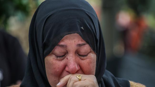 A woman mourns the death of family. Picture: Ahmad Hasaballah
