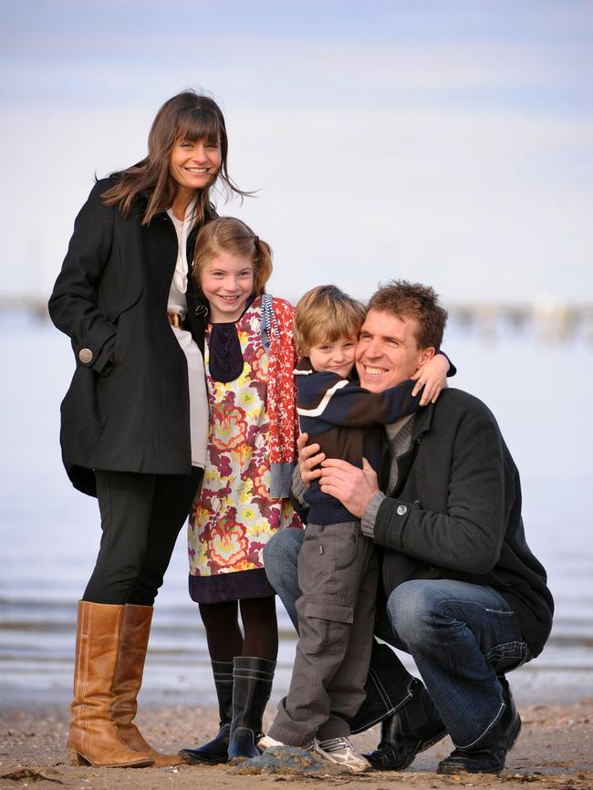 Jim Stynes with wife Sam and children Matisse and Tiernan at St Kilda beach.