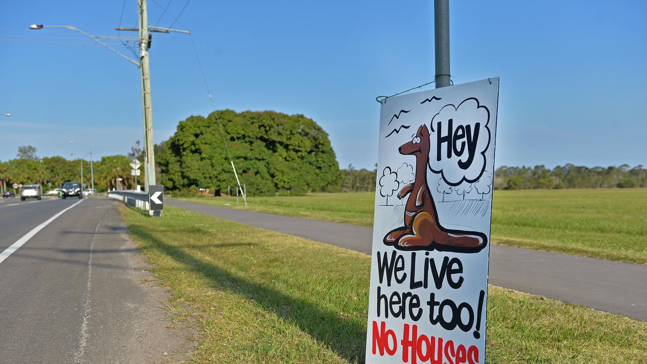 Protest signs around Twin Waters West in years gone by.