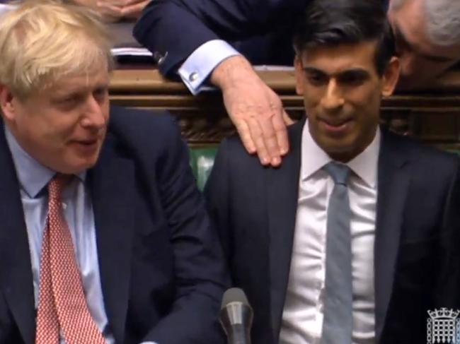 A video grab from footage broadcast by the UK Parliament's Parliamentary Recording Unit (PRU) shows Britain's Chancellor of the Exchequer Rishi Sunak being congratulated after giving his 2020 Spring budget statement in the House of Commons in London on March 11, 2020. - Britain unveils its first post-Brexit budget on Wednesday, with a focus on emergency government funding measures to combat economic fallout from the coronavirus outbreak. (Photo by STRINGER / PRU / AFP) / RESTRICTED TO EDITORIAL USE - NO USE FOR ENTERTAINMENT, SATIRICAL, ADVERTISING PURPOSES - MANDATORY CREDIT " AFP PHOTO / PRU "