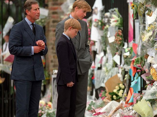 The Prince of Wales, Prince William and Prince Harry look at floral tributes to Diana, Princess of Wales outside Kensington Palace on September 5, 1997 in London, England. Picture: Getty