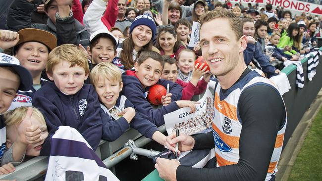 Joel Selwood signs autographs at a Geelong training session Picture: Nathan Dyer