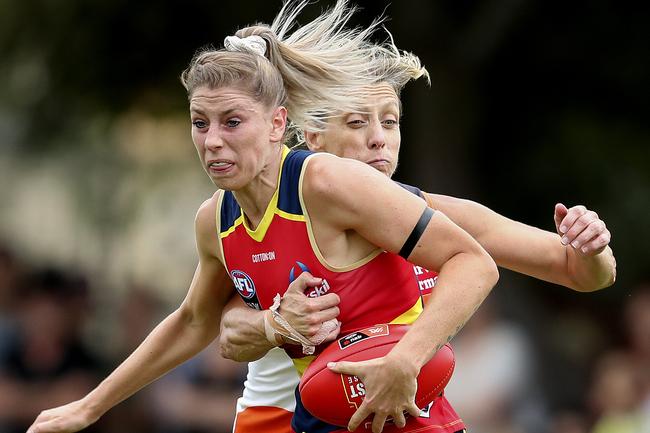 Adelaide’s Deni Varnhagen is tackled by Giants Cora Staunton at Peter Motley Oval. Picture Sarah Reed.