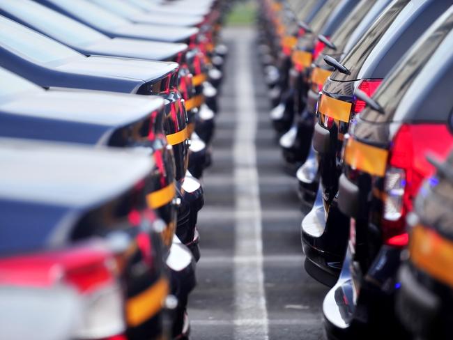 Outdoor detail shot with lot of brand new cars in a row