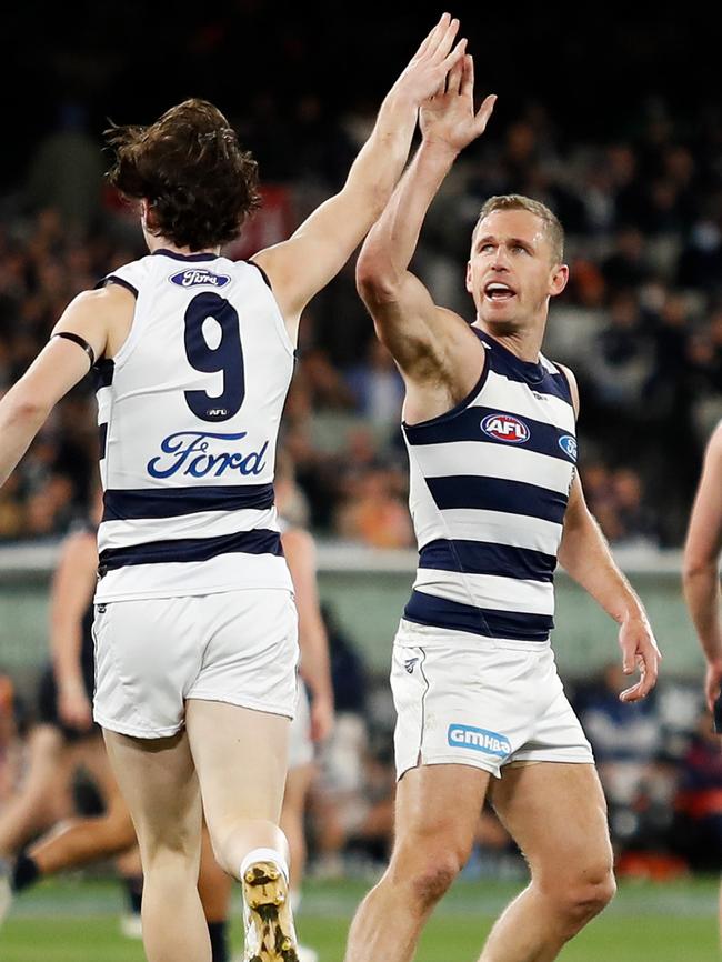 Max Holmes celebrates a goal with Joel Selwood. Picture: Dylan Burns/AFL Photos via Getty Images