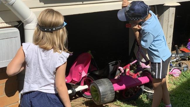 Poppy Williams and Harry Littlejohn show where they found a man hiding under Poppy’s home at Boondall. Picture: Michelle Smith